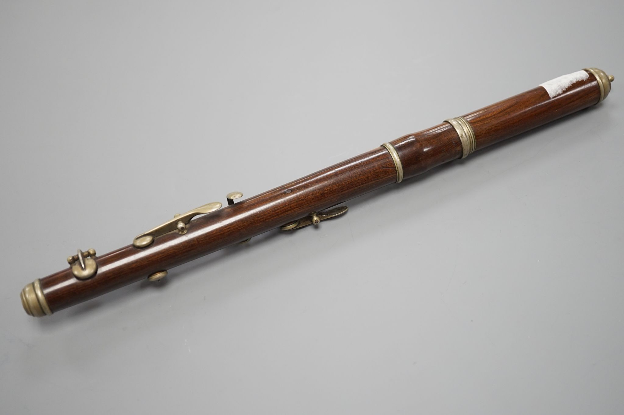 A rosewood piccolo, 32 cms long, stamped ‘for Keith Prowse Ltd. London’